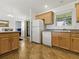 Bright kitchen featuring wood cabinets and stainless-steel appliances at 1060 Davenport Dr, The Villages, FL 32162