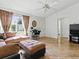 Comfortable living area featuring tile flooring, large windows, and neutral walls for easy personalization at 1060 Davenport Dr, The Villages, FL 32162