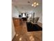 Open concept living area with bar seating, dining area, and modern furniture at 1060 Davenport Dr, The Villages, FL 32162