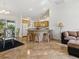 Bright living area showcasing an open design with a breakfast bar, dining area, and seamless flow at 1060 Davenport Dr, The Villages, FL 32162
