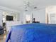 A view of the main bedroom featuring a ceiling fan and dresser at 1060 Davenport Dr, The Villages, FL 32162