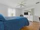 A main bedroom with a fan and view through sliding glass doors at 1060 Davenport Dr, The Villages, FL 32162