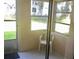Enclosed porch with a sliding glass door and a view of the outdoors at 1100 Martinique Dr # 105, Winter Haven, FL 33884
