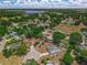 A beautiful view shows the home nestled in the neighborhood with a lake in the background at 111 Ridgeview Cir, Eustis, FL 32726