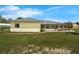 Spacious backyard with patio, perfect for outdoor gatherings and enjoying serene surroundings at 111 Ridgeview Cir, Eustis, FL 32726