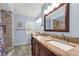 Bathroom featuring dual sinks, granite countertops, and tiled floors and shower at 111 Ridgeview Cir, Eustis, FL 32726