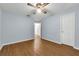 Bedroom showcasing wood-look floors, fresh neutral paint and a ceiling fan at 111 Ridgeview Cir, Eustis, FL 32726