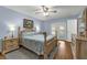 Tranquil bedroom with blue walls, wooden furniture, including a four-poster bed, and an exterior door at 111 Ridgeview Cir, Eustis, FL 32726