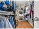 Walk-in closet features clothing racks, shelves, drawers and wood floors at 111 Ridgeview Cir, Eustis, FL 32726