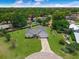 Beautiful single-story home boasting a lush green lawn and mature trees in a serene, park-like setting at 111 Ridgeview Cir, Eustis, FL 32726
