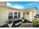 Charming front entrance with a seating area and plants at 111 Ridgeview Cir, Eustis, FL 32726