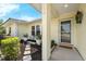 Inviting front entrance with a storm door and well-manicured landscaping at 111 Ridgeview Cir, Eustis, FL 32726