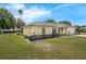 Well-maintained one-story home featuring a metal roof and a green lawn at 111 Ridgeview Cir, Eustis, FL 32726