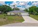 Beautiful home with a lush green lawn, mature trees, and a well-maintained exterior at 111 Ridgeview Cir, Eustis, FL 32726