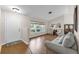 Bright living room featuring hardwood floors, a large window, and comfortable seating at 111 Ridgeview Cir, Eustis, FL 32726