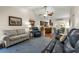 Comfortable living room showcasing open layout with dining area, kitchen, hardwood floors, and vaulted ceilings at 111 Ridgeview Cir, Eustis, FL 32726
