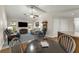 Open concept living room with vaulted ceilings, ceiling fan, access to dining area, and comfortable seating arrangement at 111 Ridgeview Cir, Eustis, FL 32726