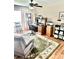 Home office space with a desk, chair, shelves, and a large area rug at 11277 Se 170Th Ln, Summerfield, FL 34491
