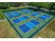 Outdoor pickleball courts with vibrant blue and green surfaces, offering a recreational amenity at 11277 Se 170Th Ln, Summerfield, FL 34491