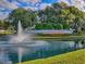 Stonecrest community water feature with a fountain, lush greenery, and beautiful water view at 11277 Se 170Th Ln, Summerfield, FL 34491