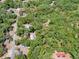 Aerial view of a wooded parcel of land outlined in red at 1203 High St, Wildwood, FL 34785