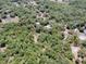 Aerial view of a wooded parcel of land outlined in red at 1203 High St, Wildwood, FL 34785