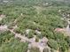 Aerial view of a wooded parcel of land outlined in red at 1203 High St, Wildwood, FL 34785