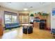 The shared community room features a futon, multiple desk spaces, and computer monitors at 12430 Ne 52Nd Loop, Oxford, FL 34484
