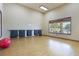 Bright fitness center with yoga mats, exercise ball, and views of the pool at 12430 Ne 52Nd Loop, Oxford, FL 34484