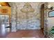 The Parkwood community lobby features a stone accent wall, community logo, and decorative touches at 12430 Ne 52Nd Loop, Oxford, FL 34484