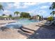 Relaxing pool view with multiple seating options and a sun shelter on a sunny day at 12430 Ne 52Nd Loop, Oxford, FL 34484