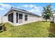 Exterior showcasing a screened-in patio and fenced yard, ideal for outdoor living at 1247 Mezzavalle Way, Auburndale, FL 33823