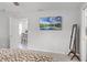 Bright bedroom boasts neutral walls, plush carpet, and a mounted television for ultimate relaxation at 1247 Mezzavalle Way, Auburndale, FL 33823