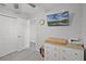 Bedroom featuring white dresser, wall-mounted TV, carpet, and closet at 1247 Mezzavalle Way, Auburndale, FL 33823