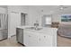 Island kitchen with stainless steel appliances and stainless dishwasher at 1247 Mezzavalle Way, Auburndale, FL 33823