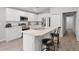 Bright kitchen with stainless steel appliances, an island, and lots of countertop space at 1247 Mezzavalle Way, Auburndale, FL 33823