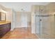 Bright bathroom featuring a glass-enclosed shower and a separate tub at 12512 Lake Ridge Cir, Clermont, FL 34711