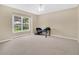 Bright bedroom featuring neutral carpet and large windows, providing ample natural light and a serene atmosphere at 12512 Lake Ridge Cir, Clermont, FL 34711