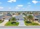 Aerial view of the neighborhood showcasing lush landscaping at 1309 Piney Woods Path, The Villages, FL 32163