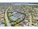 Aerial view of community pool, clubhouse, bocce ball and tennis courts at 1309 Piney Woods Path, The Villages, FL 32163