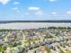 Community aerial view with lake in the background at 1309 Piney Woods Path, The Villages, FL 32163