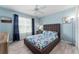 Bright bedroom with modern furniture and natural light streaming through the window at 1309 Piney Woods Path, The Villages, FL 32163