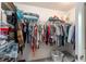 Walk-in closet with shelving and ample storage space for clothing and accessories at 1309 Piney Woods Path, The Villages, FL 32163