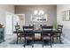 Dining area with tile floors and views into adjoining room at 1309 Piney Woods Path, The Villages, FL 32163