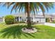 Charming home exterior with manicured lawn and mature landscaping at 1309 Piney Woods Path, The Villages, FL 32163