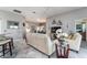 Comfortable living room with neutral tones and ample natural light at 1309 Piney Woods Path, The Villages, FL 32163