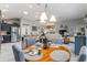 Open-concept living space featuring kitchen, dining, and living areas at 1309 Piney Woods Path, The Villages, FL 32163