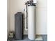 Water softener and filtration system in the garage at 1309 Piney Woods Path, The Villages, FL 32163