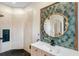 Modern bathroom featuring a walk-in shower, decorative tile accent wall, and white countertops at 13332 Via Roma Cir, Clermont, FL 34711