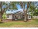 A spacious screened patio provides an indoor-outdoor living space, complete with ample seating and a bar area at 13332 Via Roma Cir, Clermont, FL 34711